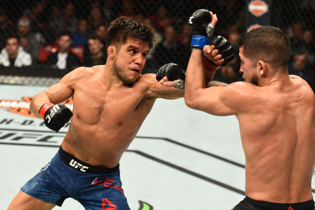 DETROIT, MI - DECEMBER 02: (L-R) Henry Cejudo punches Sergio Pettis in their flyweight bout during the UFC 218 event inside Little Caesars Arena on December 02, 2017 in Detroit, Michigan. (Photo by Josh Hedges/Zuffa LLC)