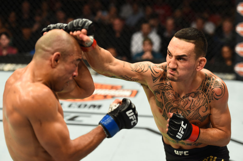 DETROIT, MI - DECEMBER 02: (R-L) Max Holloway punches Jose Aldo of Brazil in their UFC featherweight championship bout during the UFC 218 event inside Little Caesars Arena on December 02, 2017 in Detroit, Michigan. (Photo by Josh Hedges/Zuffa LLC)