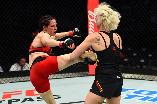 Alexis Davis kicks Cindy Dandois during their bantamweight bout at Fight Night Nashville