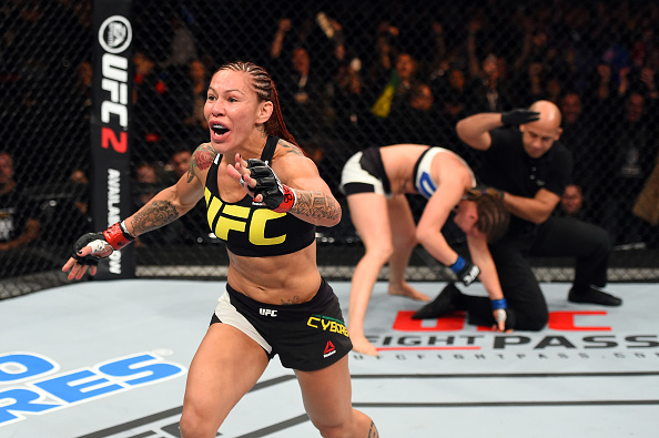 Cris Cyborg celebrates her win over Leslie Smith at UFC 198