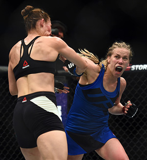 Chookagian punches Irene Aldana during their bout at UFC 210
