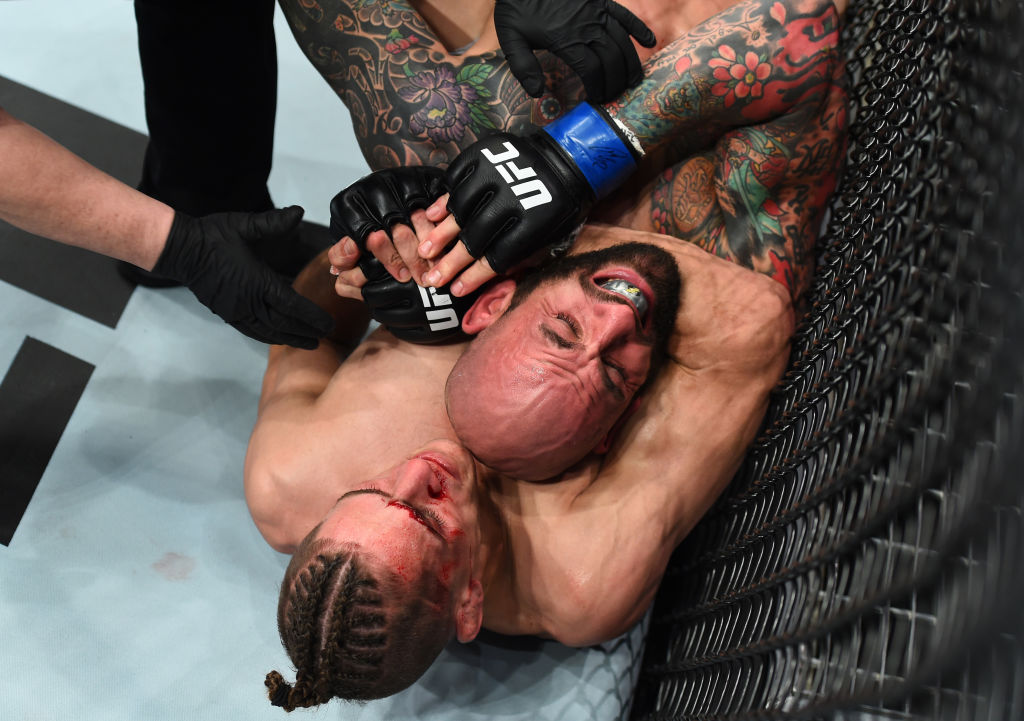 CHARLOTTE, NC - JANUARY 27: (L-R) Niko Price submits George Sullivan in their welterweight bout during a UFC Fight Night event at Spectrum Center on January 27, 2018 in Charlotte, North Carolina. (Photo by Josh Hedges/Zuffa LLC)