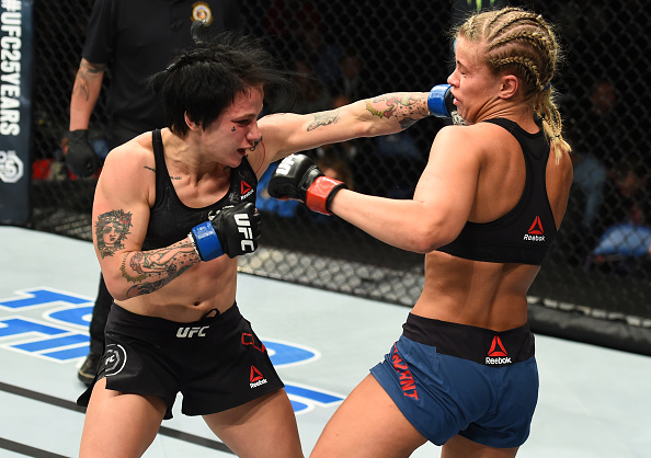 Jessica-Rose Clark punches Paige VanZant during their flyweight bout at Fight Night St. Louis