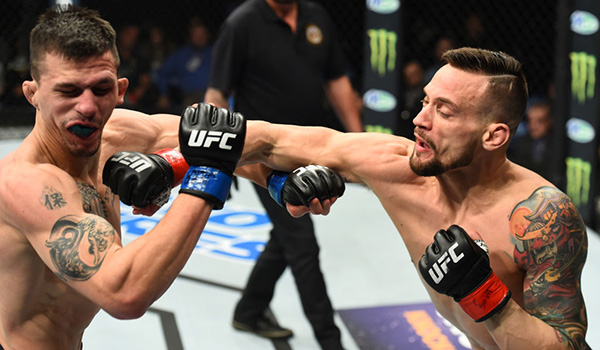 ST. LOUIS, MO - JANUARY 14: (R-L) James Krause punches Alex White in their lightweight bout during the UFC Fight Night event inside the Scottrade Center on January 14, 2018 in St. Louis, Missouri. (Photo by Josh Hedges/Zuffa LLC)