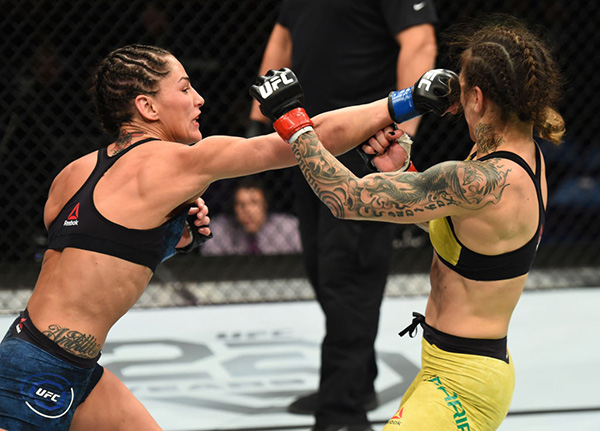 ST. LOUIS, MO - JANUARY 14: (L-R) Jessica Eye punches Kalindra Faria of Brazil in their women's flyweight bout during the UFC Fight Night event inside the Scottrade Center on January 14, 2018 in St. Louis, Missouri. (Photo by Josh Hedges/Zuffa LLC)
