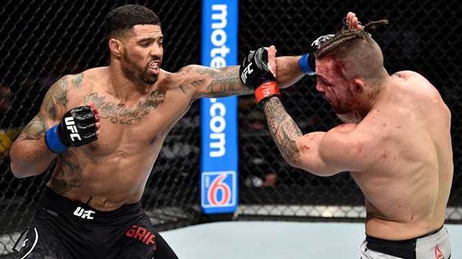 ORLANDO, FL - FEB. 24: (L-R) Max Griffin punches Mike Perry in their welterweight bout during the UFC Fight Night event at Amway Center on February 24, 2018. (Photo by Jeff Bottari/Zuffa LLC)