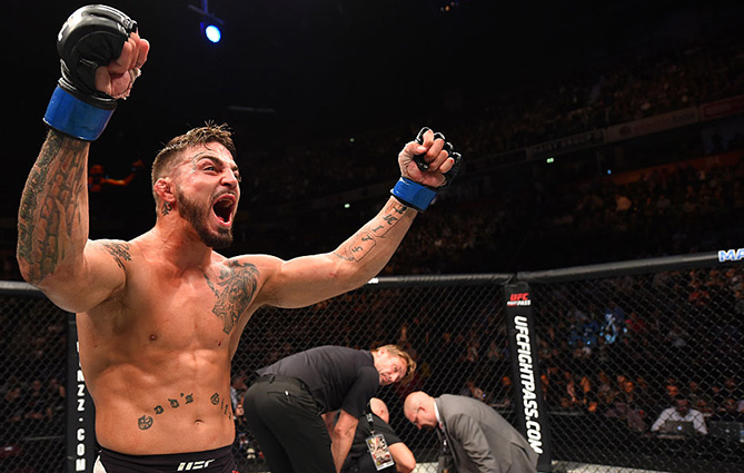 MANCHESTER, ENGLAND - OCTOBER 08: (L-R) Mike Perry celebrates his knockout victory over Danny Roberts of England in their welterweight bout during the UFC 204 Fight Night at the Manchester Evening News Arena on October 8, 2016 in Manchester, England. (Photo by Josh Hedges/Zuffa LLC/Zuffa LLC via Getty Images)