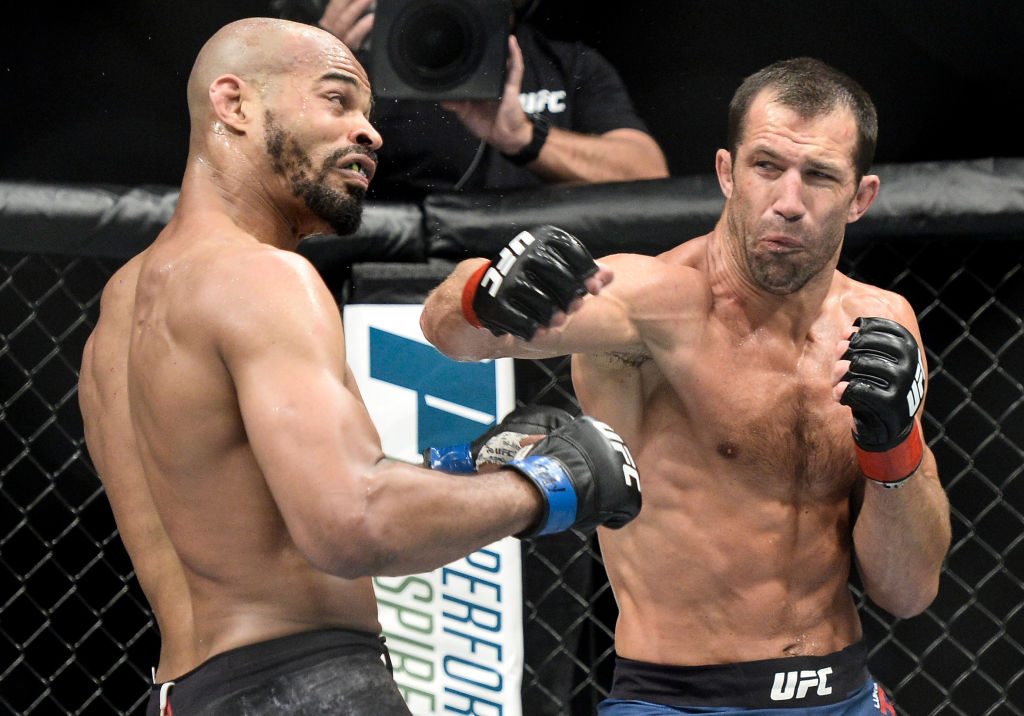 PITTSBURGH, PA - SEPTEMBER 16: (R-L) Luke Rockhold punches David Branch in their middleweight bout during the UFC Fight Night event inside the PPG Paints Arena on September 16, 2017 in Pittsburgh, Pennsylvania. (Photo by Brandon Magnus/Zuffa LLC)