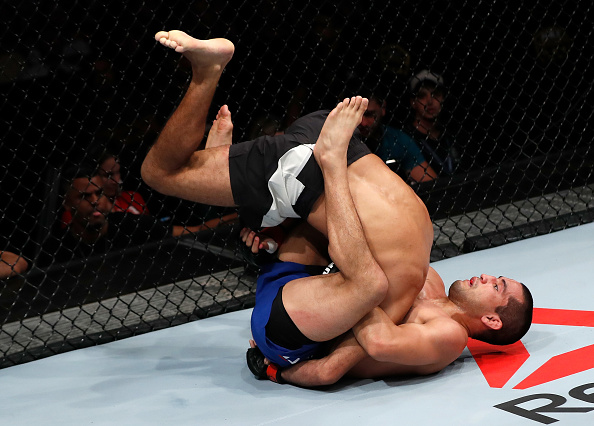 Joe Soto attempts to secure a guillotine choke submission against Rani Yahya during their bantamweight bout in March. .