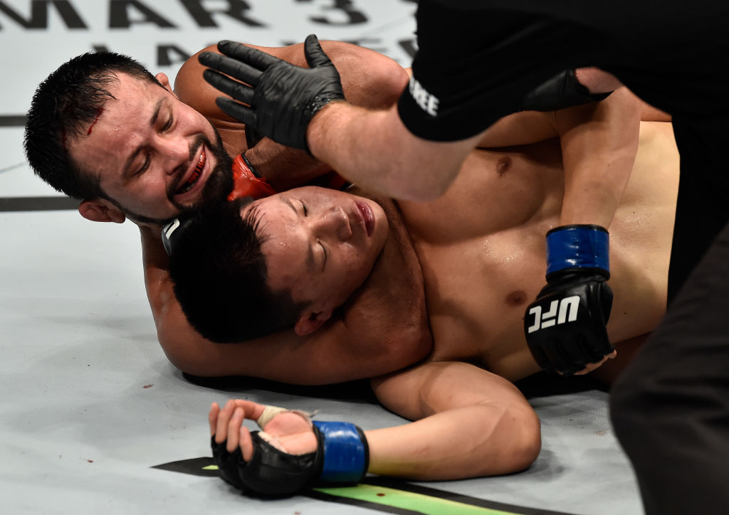 PERTH, AUSTRALIA - FEBRUARY 11: (L-R) Jussier Formiga of Brazil submits Ben Nguyen in their flyweight bout during the UFC 221 event at Perth Arena on February 11, 2018 in Perth, Australia. (Photo by Jeff Bottari/Zuffa LLC)