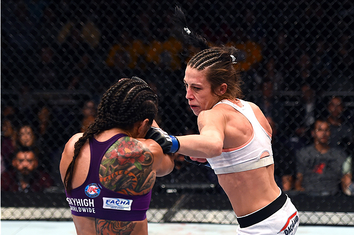 <a href='../fighter/Joanna-Jedrzejczyk'>Joanna Jedrzejczyk</a> punches <a href='../fighter/Claudia-Gadelha'>Claudia Gadelha</a> during their first meeting at Fight Night Phoenix“ align=“left“/>surprisingly, when the judges rendered their verdict, it was a split decision, but it was Jedrzejczyk emerging victorious and earning the first shot at <a href=