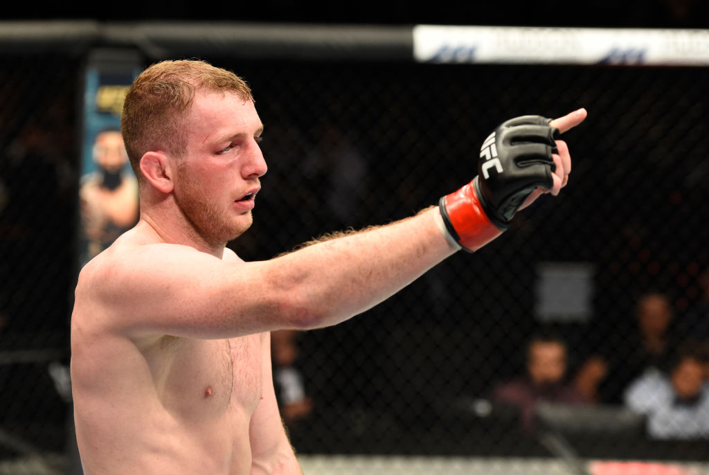 <a href='../fighter/Danny-Henry'>Danny Henry</a> raises his hand after facing <a href='../fighter/Daniel-Teymur'>Daniel Teymur</a> during the <a href='../event/UFC-Silva-vs-Irvin'>UFC Fight Night </a>on July 16, 2017 in Glasgow, Scotland. (Photo by Josh Hedges/Zuffa LLC)“ align=“center“/> UFC fans may have gotten their first dose of Danny Henry last July when he debuted in his home country of Scotland with a Fight of the Night win over Daniel Teymur. But discerning fight fans already knew of “The Hatchet” thanks to his status as MMA’s next big thing…<p>In Africa?</p><p>“It’s a bit of a mad story,” Henry begins, telling how he wound up fighting the seven fights prior to his UFC signing in South Africa for the EFC promotion.</p><p>“They were an all-African organization initially. Then they decided to go worldwide and they scouted Europe and other places for reputable gyms and fighters. Just by chance, they stumbled across some UK town and spoke to my coach, James Doolan, and said, ‘Look, have you got any featherweights?’”</p><p>Doolan did have featherweights on the Higher Level Martial Arts team, mainly veteran Graham Turner. But he was too experienced for EFC, which wanted to build some stars from around the globe. Doolan asked Henry, 4-1 at the time and fighting at lightweight, if he could make 145 pounds.</p><p>“I said, ‘Yeah, let’s go.’ And it all went from there. I signed the deal and the next thing I knew, I was flying out to Africa to fight.”</p><p>On the average, Henry traveled 14 to 15 hours from his hometown in Edinburgh to spots like Cape Town and Johannesburg to fight the local standouts. He wasn’t the most popular guy in the building on fight night.</p><p>“Everyone booed the f**king life out of me,” he said. “But it definitely did help. I’m a miserable bastard; I’ll do anything to ruin their day. (Laughs) I think some of the boos actually got me through the fight, to be honest.”</p><p>In his seven fights for EFC from 2015 to 2017, Henry went 6-1 and won the promotion’s featherweight title twice. And looking back, there are no regrets – with the exception of those plane rides.</p><p>“I just took it as an opportunity,” he said. “I’m gonna get to go and see this country and get to do what I enjoy doing. It’s all about making the sport work for you as well as you working for the sport. And if you can get and see other countries and perform in front of different nations, why not take the opportunity while it’s there? And I enjoyed it. I loved it. Cape Town is one of the most beautiful places I’ve ever been in my life. It’s an unbelievable place.”</p><p><strong><span class=