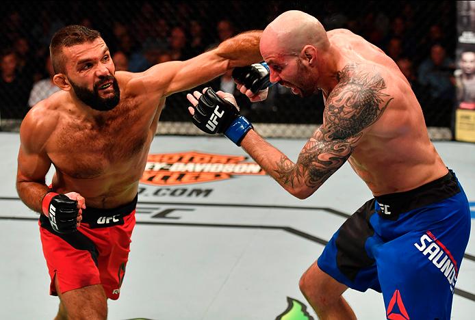 STOCKHOLM, SWEDEN - MAY 28: (L-R) Peter Sobotta punches Ben Saunders in their welterweight fight during the UFC Fight Night event at the Ericsson Globe Arena on May 28, 2017 in Stockholm, Sweden. (Photo by Jeff Bottari/Zuffa LLC/Zuffa LLC via Getty Images) 