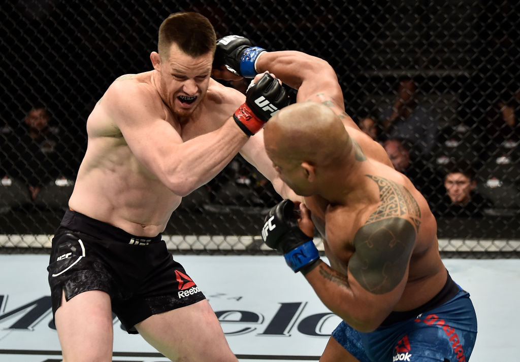 LAS VEGAS, NV - MARCH 03: (R-L) Hector Lombard of Cuba punches CB Dollaway in their middleweight bout during the UFC 222 event inside T-Mobile Arena on March 3, 2018 in Las Vegas, Nevada. (Photo by Jeff Bottari/Zuffa LLC)