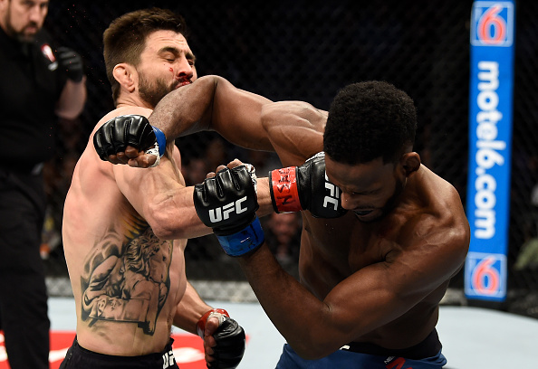 LAS VEGAS, NV - DECEMBER 30: (L-R) Carlos Condit punches Neil Magny in their welterweight bout during the UFC 219 event inside T-Mobile Arena on December 30, 2017 in Las Vegas, Nevada. (Photo by Jeff Bottari/Zuffa LLC/Zuffa LLC via Getty Images)