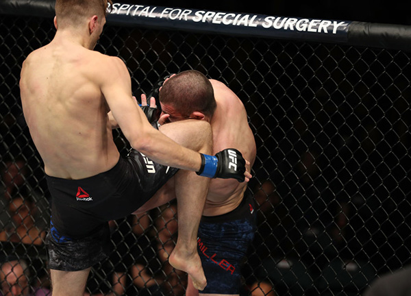 Dan Hooker knees Jim Miller on April 21, 2018 in Atlantic City, NJ. (Photo by Patrick Smith/Zuffa LLC)