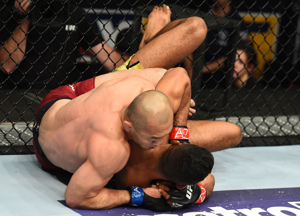 Yushin Okami of Japan controls the body of Dhiego Lima of Brazil in their welterweight fight during the UFC Fight Night event at the Gila Rivera Arena on April 14, 2018 in Glendale, Arizona. (Photo by Josh Hedges/Zuffa LLC)