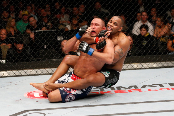 <a href='../fighter/Daniel-Cormier'>Daniel Cormier</a> attempts to submit <a href='../fighter/Dan-Henderson'>Dan Henderson</a> during UFC 173 (Photo by Josh Hedges/Zuffa LLC via Getty Images)“ align=“center“/><p><strong>UFC 173: Dillashaw claims gold; Cormier earns title shot</strong></p><p>Injuries and adjustments changed the complexion of the card in the weeks leading up to 2014’s Memorial Day event in Las Vegas, but the action built to a crescendo and when the night was over, a new contender had emerged in the light heavyweight division and the bantamweight ranks had a new ruler.</p><p>Three months after making his divisional debut, Daniel Cormier earned himself a title shot with a one-sided drubbing of Dan Henderson. If you were to just happen upon this fight in passing on television, you might think you were watching a WWE squash match – that’s how badly Cormier rag-dolled the former two-divisional PRIDE world champion.</p><p>In running through Henderson, Cormier pushed his record to 15-0 overall and set the stage for a championship showdown with <a href=