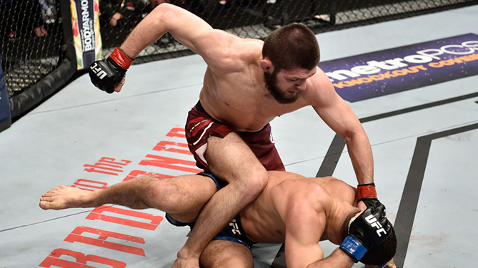 BROOKLYN, NEW YORK - APRIL 07: (L-R) Khabib Nurmagomedov of Russia punches Al Iaquinta in their lightweight title bout during the UFC 223 event inside Barclays Center on April 7, 2018 in Brooklyn, New York. (Photo by Jeff Bottari/Zuffa LLC)