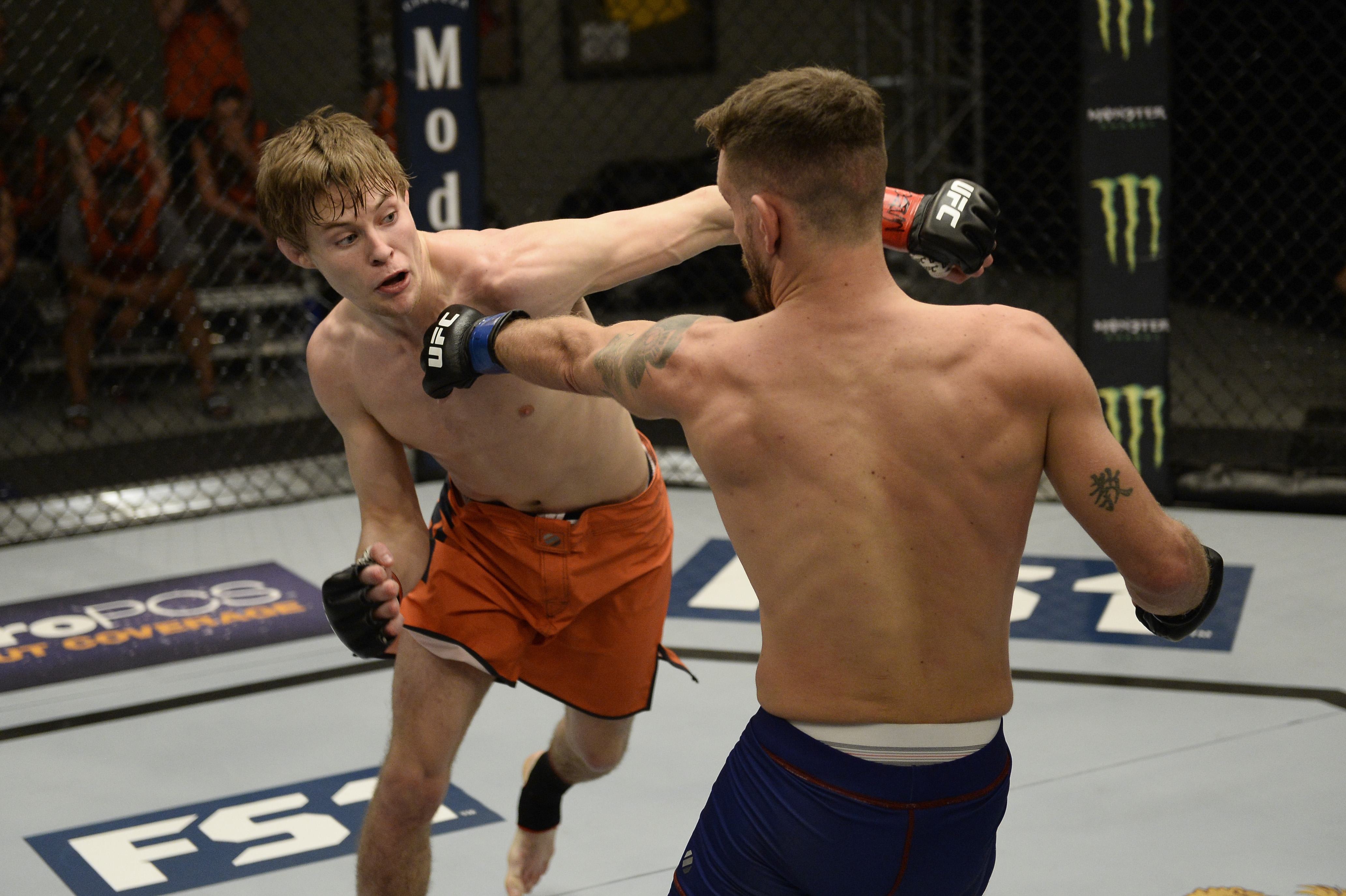 Bryce Mitchell (L) punches Jay Cucciniello during the filming of The Ultimate Fighter: Undefeated (Photo by Brandon Magnus/Zuffa LLC)
