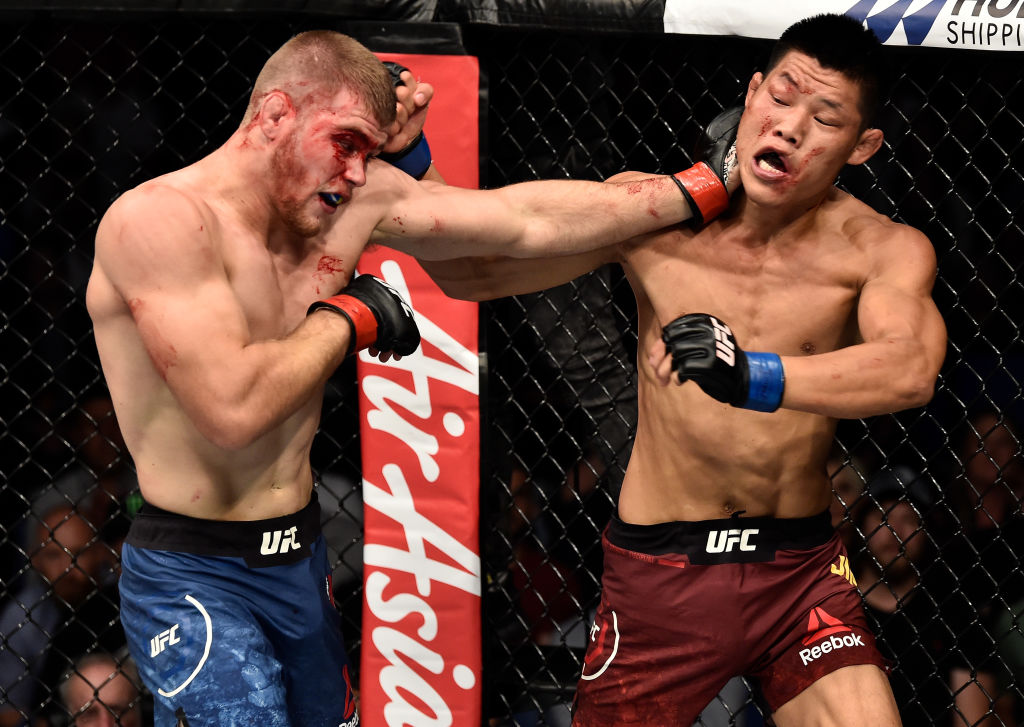 Jake Matthews & Li Jingliang fought in Perth at UFC 221. They'll both be featured in separate bouts on the Fight Night Singapore card (Photo by Jeff Bottari/Zuffa LLC)