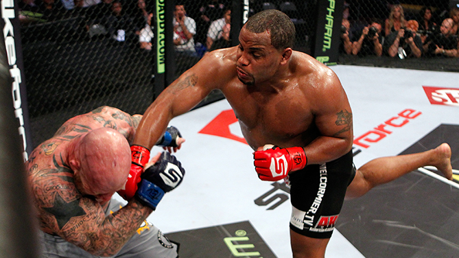 DALLAS, TX - JUNE 18: Daniel Cormier (black shorts) punches Jeff Monson during a Heavyweight bout at the Strikeforce event at American Airlines Center on June 18, 2011 in Dallas, Texas. (Photo by Esther Lin/Forza LLC/Forza LLC via Getty Images)