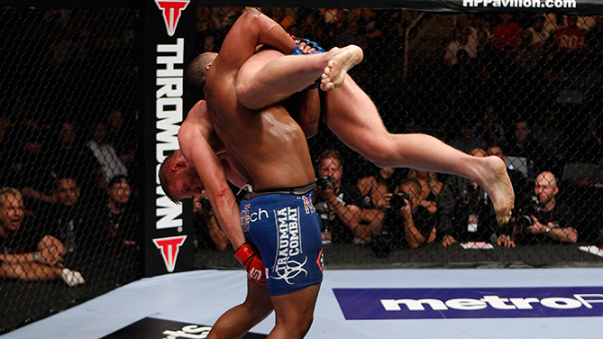 SAN JOSE, CA - MAY 19: Daniel Cormier (blue shorts) picks up Josh Barnett during the Strikeforce event at HP Pavilion on May 19, 2012 in San Jose, California. (Photo by Esther Lin/Forza LLC/Zuffa LLC via Getty Images)