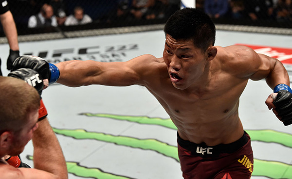 PERTH, AUSTRALIA - FEBRUARY 11: (R-L) <a href='../fighter/Li-Jingliang'>Li Jingliang</a> of China punches <a href='../fighter/jake-matthews'>Jake Matthews</a> of Australia in their welterweight bout during the UFC 221 event at Perth Arena on February 11, 2018 in Perth, Australia. (Photo by Jeff Bottari/Zuffa LLC/Zuffa LLC via Getty Images)“ align=“center“/><br />China’s Li Jingliang has paid his dues in fighting and in life. In March, he turned 30. Now the fun begins.<p>“An old Chinese saying is that 30 is the year to stand up in a person’s life,” said Li through a translator. “I am married with a lovely wife and daughter now, and I want to be best the best version of myself in the coming years, to be the face of China Power, to be the best father, to love and protect my family. I will keep up my own style and I will not leave my career as a professional MMA fighter with any regrets.”</p><p>That idea of attacking life and not waiting for it to happen has translated into his fighting style, one that has led him to wins in six of his nine UFC bouts heading into a Saturday showdown with Japan’s <a href=