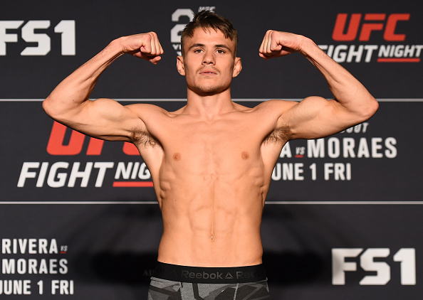 UTICA, NY - MAY 31: <a href='../fighter/Nathaniel-Wood'>Nathaniel Wood</a> of England poses on the scale during the UFC weigh-in at the DoubleTree Hotel on May 31, 2018 in Utica, New York. (Photo by Josh Hedges/Zuffa LLC/Zuffa LLC via Getty Images)“ align=“center“/><br />With a 13-3 pro MMA record that includes a five-fight winning streak (all by knockout or submission), Octagon newcomer Nathaniel Wood has earned his nickname, “The Prospect.” But what happens if and when he soars up to the top of the bantamweight division? Will a nickname change be in order?<p>“That’s the debate I’m having at the moment with my coaches,” he laughed. “What they said is that once you get that belt, then you go for pound-for-pound number one. So I think until I hit that spot, I think for now I’m gonna stay with ‘The Prospect.’”</p><p>Sounds like a plan, and even now, if you’re walking around with a moniker like that, people will be expecting big things. That’s fine with Wood, because he has high expectations of his own.</p><p>“I’ve been ready for ages,” Wood said. “The time that it’s taken the UFC to get me here has just meant that I’ve been able to build an even bigger brand and I’ve been able to become a bigger name. So now the UFC have come, I’m a bigger name from the start, and hopefully I’ll be get in there and get in with the top guys straight from the get go.”</p><p>He’s got a tough test the first time out on Friday, as he battles Brazilian veteran <a href=