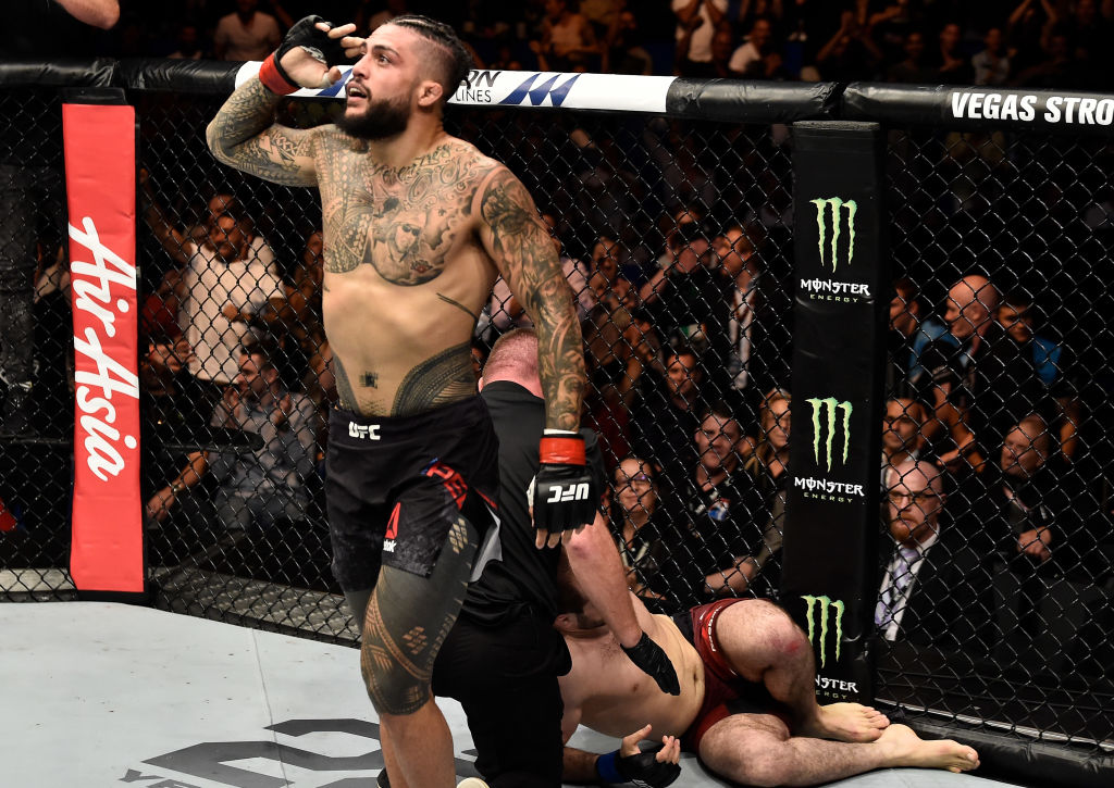 PERTH, AUSTRALIA - FEBRUARY 11: (L-R) Tyson Pedro of Australia celebrates his submission victory over <a href='../fighter/saparbek-safarov'>Saparbek Safarov</a> of Russiain their light heavyweight bout during the UFC 221 event at Perth Arena on February 11, 2018 in Perth, Australia. (Photo by Jeff Bottari/Zuffa LLC/Zuffa LLC via Getty Images)“ align=“center“/><br />“All smiles” would be an apt nickname for Pedro.</p><p>When Pedro walks to the UFC Octagon grinning ear to ear, it doesn’t feel like a gimmick. Despite the grind of training day in and day out, or the uncertain journey towards the UFC belt, it isn’t lost on Pedro that he’s doing what he wants to do for a living.</p><p>A big part of that, says Pedro, is the fact he’s worked other jobs. He’s had a stint with the Australian army, delivered gyprock, and been a telecommunications technician, a roofer and a cook.</p><p>So being paid to fight and train wasn’t always a given for the 26-year-old Western Sydney native.</p><p>“Yeah (having worked in other jobs) is a big part of it. I never take it for granted that I’m doing exactly the job I want to be doing in my life at this time. And I’m always shooting for that gold, but I’m taking this whole ride as a journey,” said Pedro. “Every day training sucks, every day it hurts, every day the grind is s**t, but I love that, and you just have to embrace that part of it. And I think once you start loving all of that hurting, it makes it a lot easier.”</p><p>The number 13-ranked Pedro’s pursuit of the grind has led him to be a regular at Jackson-Wink MMA and <a href=