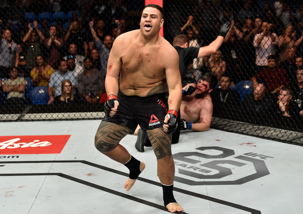 PERTH, AUSTRALIA - FEBRUARY 11: (L-R) <a href='../fighter/Tai-Tuivasa'>Tai Tuivasa</a> of Australia celebrates his victory over <a href='../fighter/cyril-asker'>Cyril Asker</a> of France in their heavyweight bout during the UFC 221 event at Perth Arena on February 11, 2018 in Perth, Australia. (Photo by Jeff Bottari/Zuffa LLC/Zuffa LLC via Getty Images)“ align=“center“/><br />Tai Tuivasa, who fights <a href=