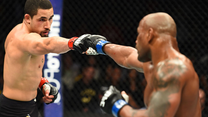 <a href='../fighter/Yoel-Romero'>Yoel Romero</a> and <a href='../fighter/robert-whittaker'>Robert Whittaker</a> touch gloves at the start of round two during UFC 225 on June 9, 2018 in Chicago, IL. (Photo by Josh Hedges/Zuffa LLC)“/>CHICAGO –</strong> After the first round of his rematch against Yoel Romero Saturday night at UFC 225, Robert Whittaker went back to his corner for the second straight fight with a serious injury.</p><p>Whittaker broke his right hand and still had 20 minutes of fight time left with one of the most dangerous pound-for-pound fighters on the planet.</p><p>Talk about bad luck.</p><p>In the first matchup, Whittaker suffered a medial ligament injury to his left knee in the first round at UFC 213. He went on to win after digging deep in the championship rounds despite the injury.</p><p>Australia’s Whittaker did it again in Chicago and after 50 minutes of classic MMA fight time with Romero his star continues to shine bright.</p><p><em>These are the UFC 225 Talking Points</em></p><p><strong>What lies ahead for “The Reaper”</strong></p><blockquote class=