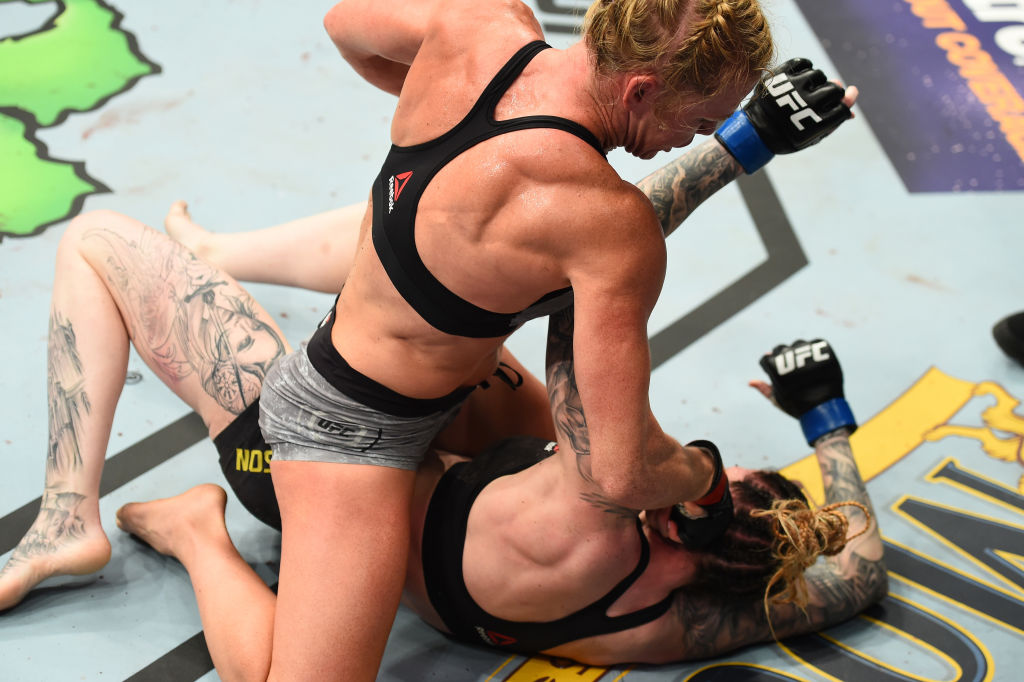 Holly Holm punches <a href='../fighter/megan-anderson'>Megan Anderson</a> at UFC 225 (Photo by Josh Hedges/Zuffa LLC)“/>For a long time, Holly Holm has been the greatest enigma in MMA. Not in the women’s bantamweight or featherweight divisions, but the whole sport. Supremely talented, with a level of combat sports experience that dwarves that of 99.9% of her opponents, Holm has seemingly been in a rut since losing her 135-pound title to <a href=