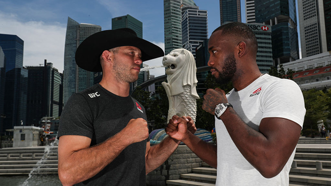 SINGAPORE, SINGAPORE - APRIL 25: Donald Cerrone (L) and Leon Edwards pose for a photo at the Merlion Park, overlooking the financial district, on April 25, 2018 in Singapore. (Photo by Yong Teck Lim/Zuffa LLC)