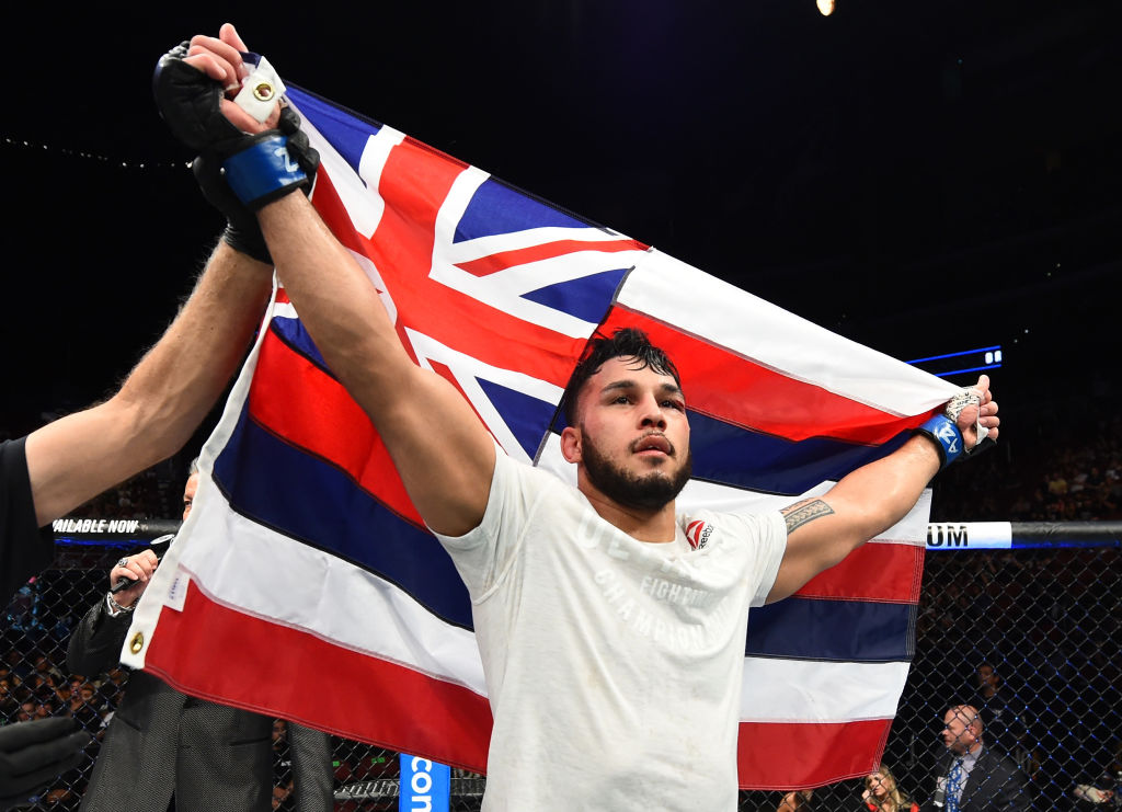 GLENDALE, AZ - APRIL 14: Brad Tavares celebrates his victory over <a href='../fighter/Krzysztof-Jotko'>Krzysztof Jotko</a> of Poland in their middleweight fight during the <a href='../event/UFC-Silva-vs-Irvin'>UFC Fight Night </a>event at the Gila Rivera Arena on April 14, 2018 in Glendale, Arizona. (Photo by Josh Hedges/Zuffa LLC/Zuffa LLC via Getty Images)“ align=“left“/>great. Hawaii is being represented to the fullest.</p><p>“We have a champion from Hawaii and I’m sure we’ll see more champions from Hawaii. It’s a great time for Hawaiian MMA and to be a Hawaiian fighter and fan.”</p><p>As for things within the long-time Las Vegas training outpost, Tavares was a little surprised to realize that it has already been six months since Follis’ passing, but acknowledged that losing the highly respected coach brought everyone in the gym closer together and said that having so many teammates getting ready to compete within close proximity to one another has created a positive energy with the gym.</p><p>“It was a very hard time for us as a team, but I think it pulled us together tighter,” he offered. “We had a little sit-down after everything came to light and one of the things that was brought up was, ‘We’re a team and if you ever feel like you’re alone, you’re not. You always have your teammates. We might not all be the best of friends and hanging out every single moment, but at the end of the day, you’re my teammate, my brother, my sister and I want to be there for you.’</p><p>“That’s something we took away from that, and moving forward we just really want to represent Follis, make him proud and I think we’re doing that. It was very tragic for us, but we took all the positives we could from that moment and we moved forward well.</p><p>“It’s been amazing,” he added in regards to the crush of activity taking place inside the gym. “The vibe in the gym has been so good, so positive with everybody getting ready for fights and being on the same track.”</p><p>And this weekend, he intends to channel that energy into his performance, deal with Adensanya and continue his steady, silent march towards the top of the middleweight division.</p><p>“I want to get to that gold, to that strap – be the middleweight champion – and this is the next guy in line. I’ll go out there, beat him and then on to the next one.”</p></div><footer><div class=