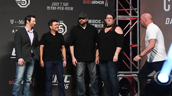 UFC 3 Be the Boss winner John Farmer and his guest Karie Durnell stand on-stage with UFC President Dana White during the UFC 226 weigh-ins at T-Mobile Arena in Las Vegas, NV.