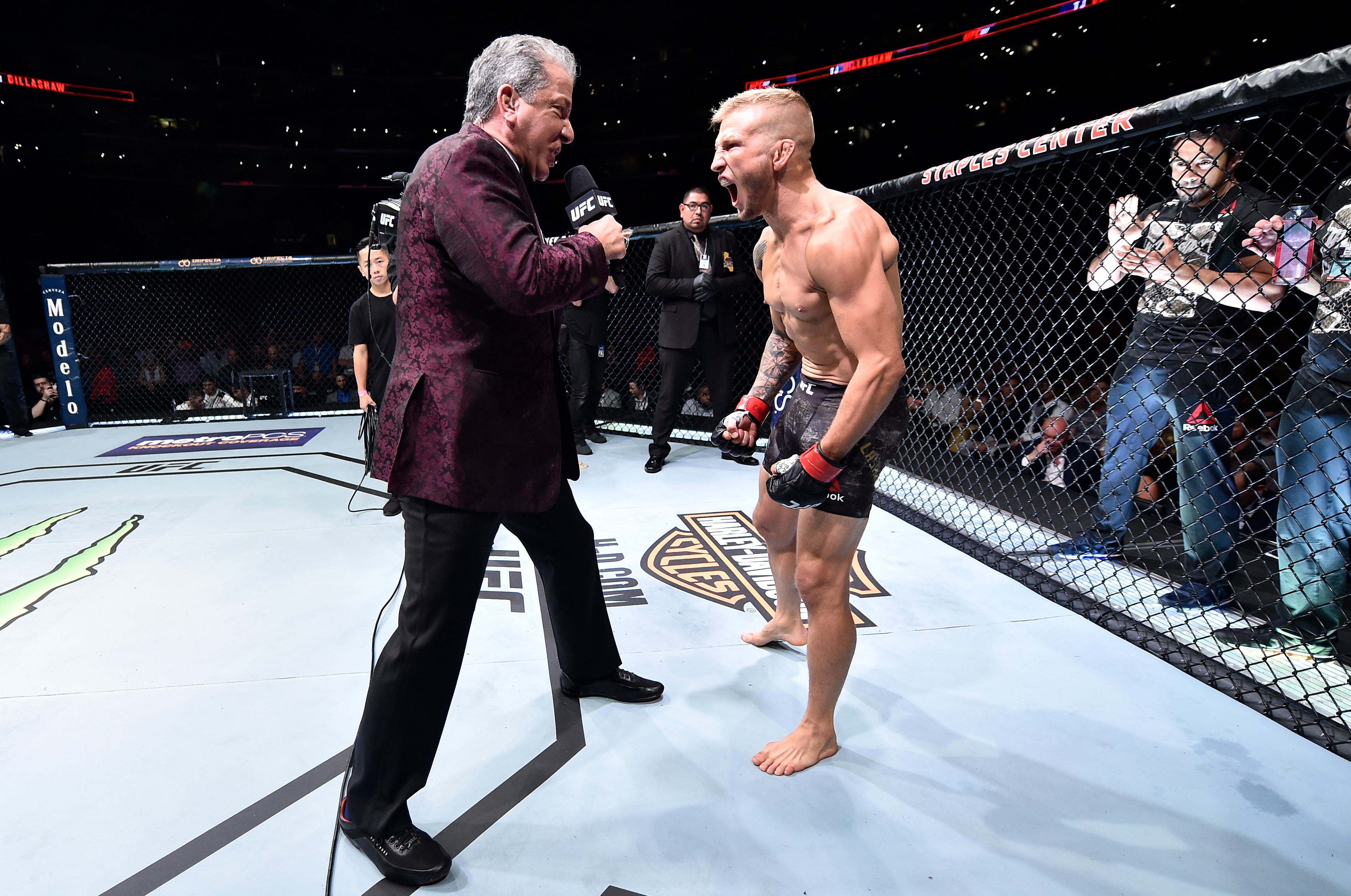 LOS ANGELES, CA - AUGUST 04: <a href='../fighter/TJ-Dillashaw'>TJ Dillashaw</a> is introduced by Bruce Buffer prior to his UFC bantamweight championship fight against <a href='../fighter/cody-garbrandt'>Cody Garbrandt</a> during the UFC 227 event inside Staples Center on August 4, 2018 in Los Angeles, California. (Photo by Jeff Bottari/Zuffa LLC/Zuffa LLC via Getty Images)“ align=“center“/></p><p>One champion successfully defended his title and a new king was crowned as UFC 227 unfolded on Saturday night from Los Angeles.</p><p>In the main event, TJ Dillashaw slammed the door on his longtime rivalry with former teammate Cody Garbrandt with a stunning first-round KO to hold on to his bantamweight title.</p><p>Both fighters were definitely gunning for the knockout, but it was Dillashaw who used pinpoint accuracy and a devastating counterstrike to put Garbrandt on wobbly legs midway through the opening round.</p><p>From there, Dillashaw just poured on the punishment as he unleashed a barrage of strikes that finally put Garbrandt down and out to end the fight.</p><p>Heading into Saturday night, the main event was as split down the middle as could be, with fantasy players giving a very slight advantage to Dillashaw, with 53 percent favoring him to win. Another 64 percent predicted he would win by knockout, and ultimately all the players who chose Dillashaw earned an extra 150-point bonus because it was a title fight.</p><p><iframe src=