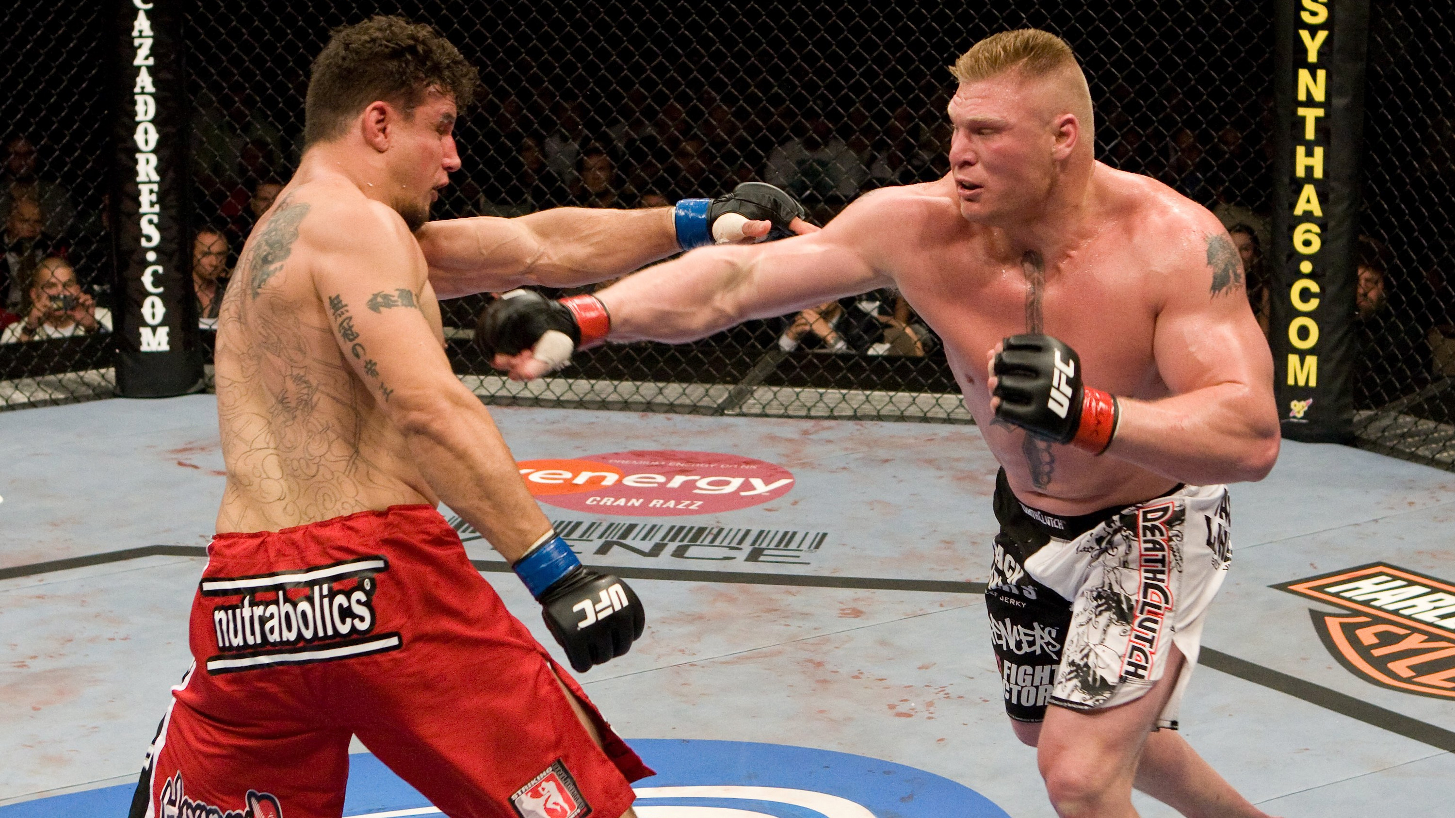 LAS VEGAS - JULY 11: Brock Lesnar (black/white shorts) def. Frank Mir (red shorts) - TKO - 1:48 round 2 during UFC 100 at Mandalay Bay Events Center on July 11, 2009 in Las Vegas, Nevada. (Photo by Josh Hedges/Zuffa LLC via Getty Images)