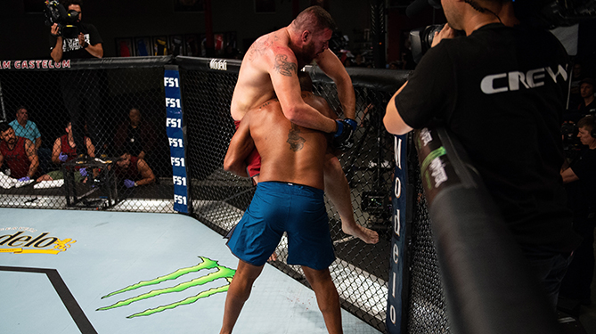 LAS VEGAS, NV - JULY 26: (L-R) Michel Batista takes down Josh Parisian during the filming of The Ultimate Fighter: Heavy Hitters on JULY 26, 2018 in Las Vegas, Nevada. (Photo by Chris Unger/Zuffa LLC via Getty Images)