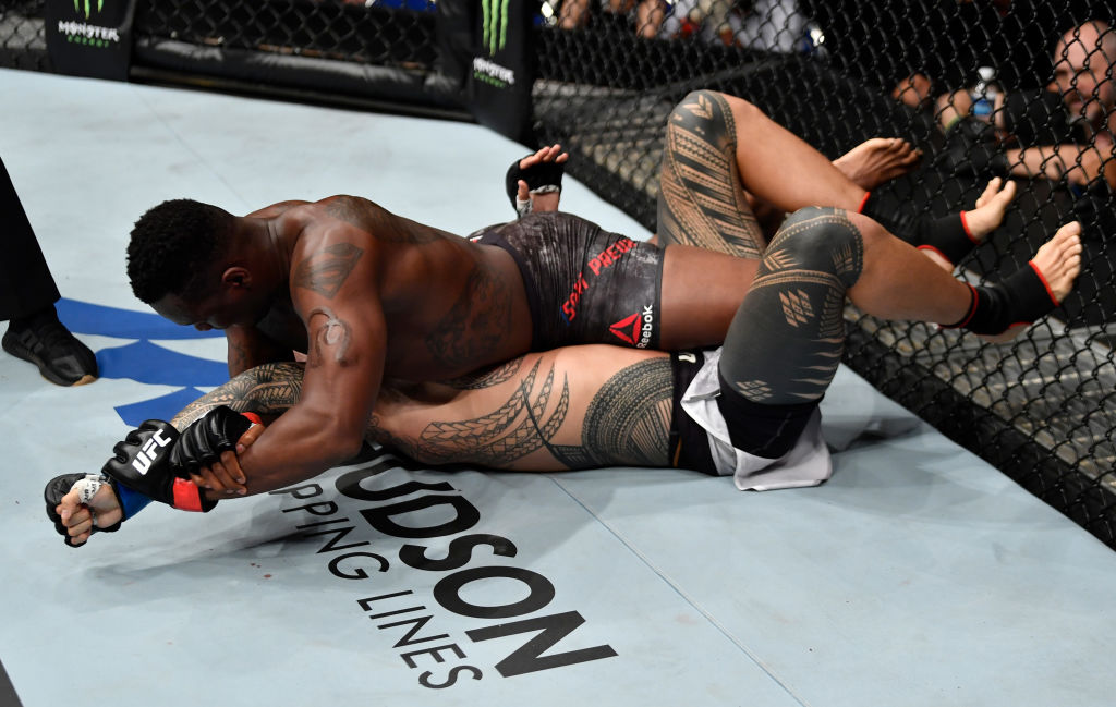 SINGAPORE - JUNE 23: (R-L) Ovince Saint Preux secures an arm bar submission against Tyson Pedro of Australia in their light heavyweight bout during the UFC Fight Night event at the Singapore Indoor Stadium on June 23, 2018 in Singapore. (Photo by Jeff Bottari/Zuffa LLC/Zuffa LLC via Getty Images)