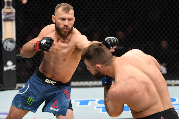 DENVER, CO - NOVEMBER 10: (L-R) <a href='../fighter/Donald-Cerrone'>Donald Cerrone</a> punches <a href='../fighter/mike-perry'>Mike Perry</a> in their welterweight bout during the <a href='../event/UFC-Silva-vs-Irvin'>UFC Fight Night </a>event inside Pepsi Center on November 10, 2018 in Denver, Colorado. (Photo by Josh Hedges/Zuffa LLC/Zuffa LLC via Getty Images)“ align=“center““/> Before <a href=