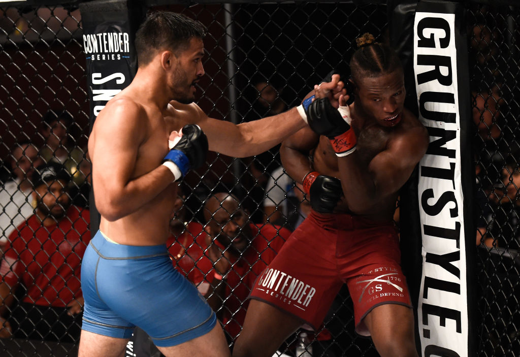 (L-R) Julio Arce punches Peter Petties in their featherweight bout during Dana White's Tuesday Night Contender Series at the TUF Gym on August 8, 2017 in Las Vegas, Nevada. (Photo by Brandon Magnus/DWTNCS)