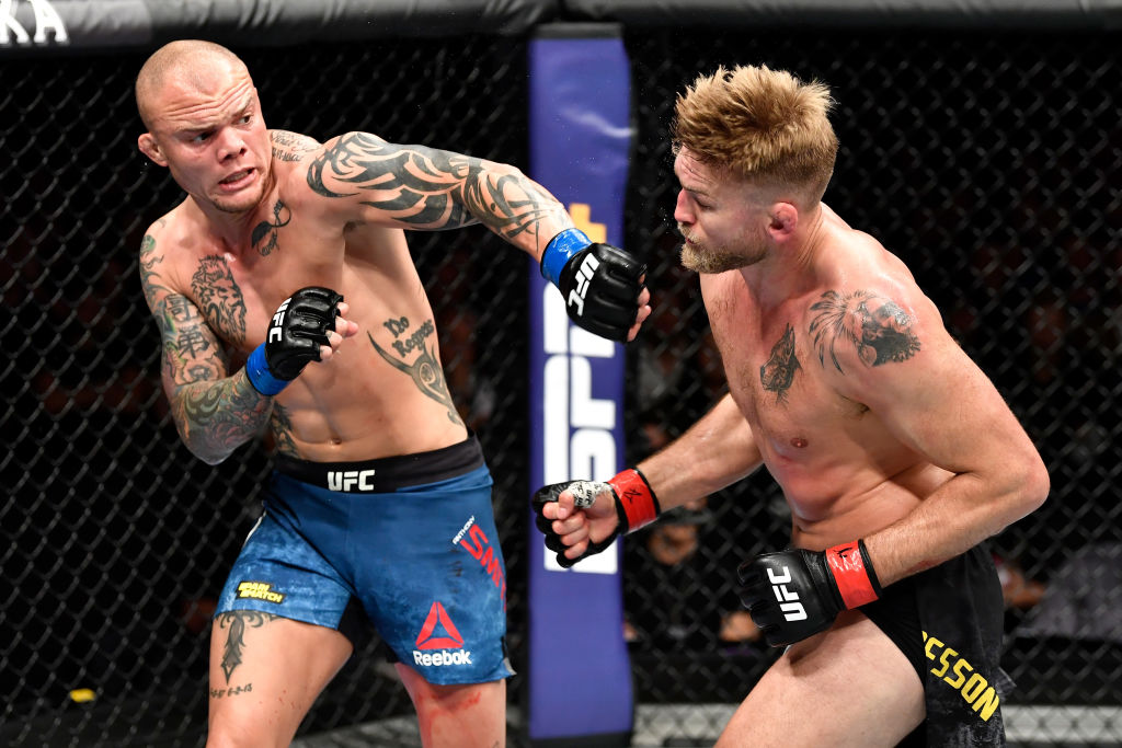  Anthony Smith punches Alexander Gustafsson of Sweden in their light heavyweight bout during the UFC Fight Night event at Ericsson Globe on June 1, 2019 in Stockholm, Sweden.