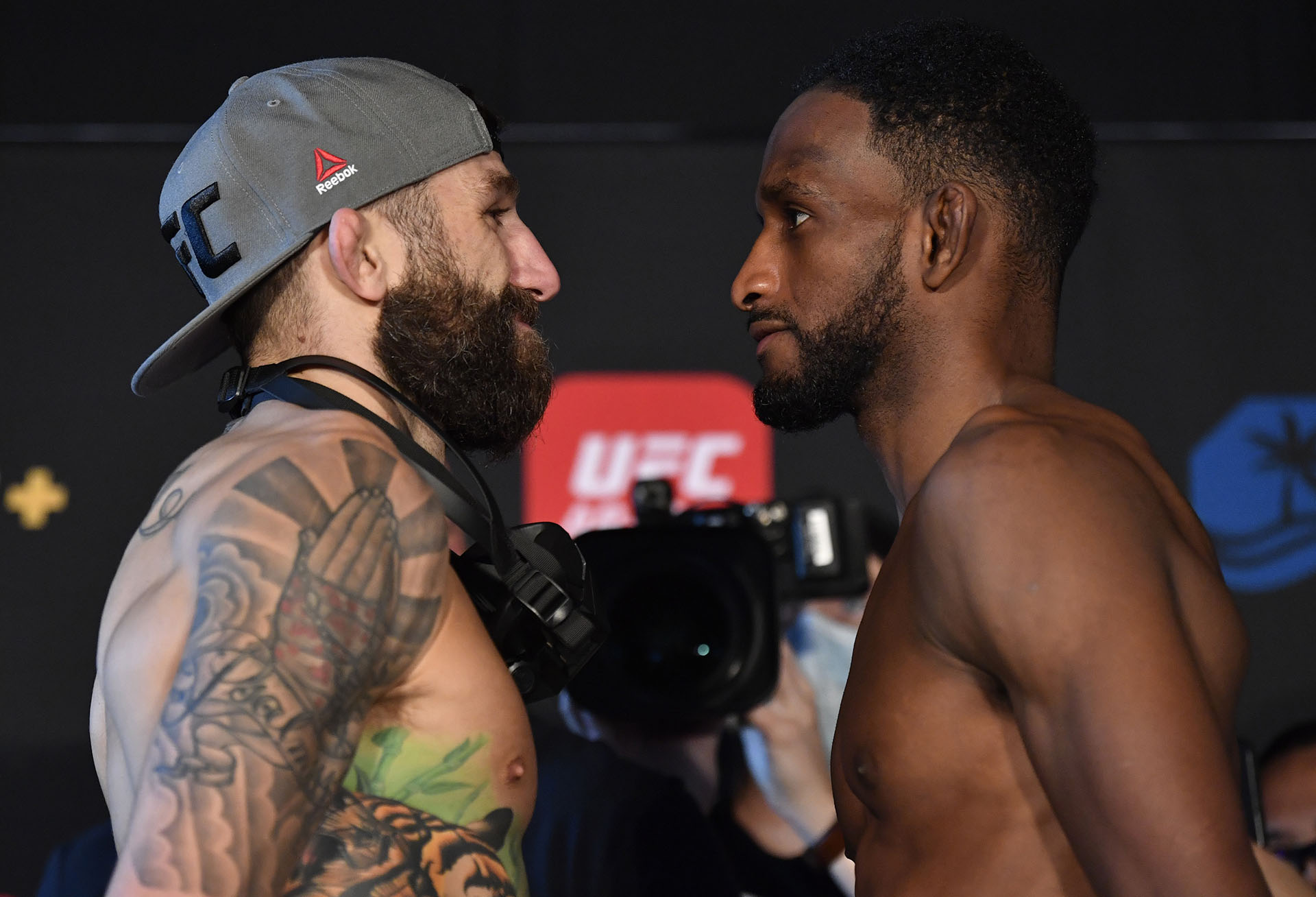 Opponents Michael Chiesa and Neil Magny face off during the UFC weigh-in at Etihad Arena on UFC Fight Island on January 19, 2021 in Abu Dhabi, United Arab Emirates